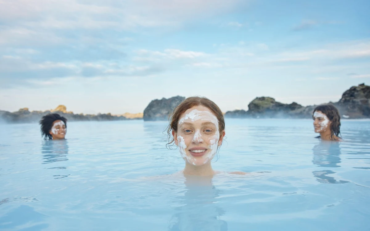 Steam rising off a geothermal bathing pool in the lava landscape outside Reykjavik